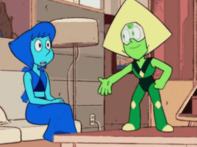 Lapis Lazuli And Peridot Are Sitting On A Couch Talking To Each Other . GIF