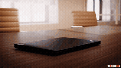 Laptop On Wooden Table With Thinkjules GIF
