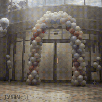 Large Balloon Arch In Front Of Building Saying Randarent GIF