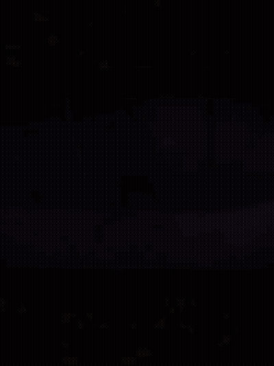 Large Bell Hanging From Rope Over Water GIF