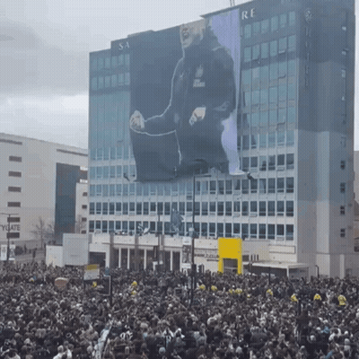 Large Billboard With Man Saying Re GIF