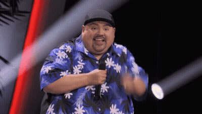 Large Black Truck Driving Next To Race Car GIF