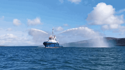 Large Blue And White Boat Spraying Water GIF