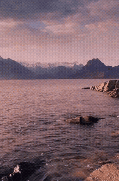 Large Body Of Water With Mountains And Rocks GIF