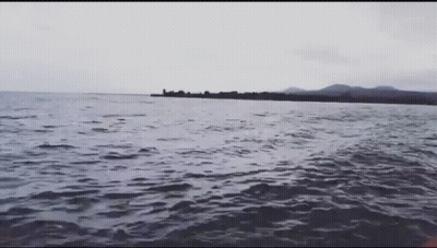 Large Body Of Water With Small Island GIF