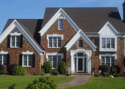 Large Brick House With Gray Roof And Windows GIF