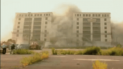 Large Building Demolished With Smoke GIF