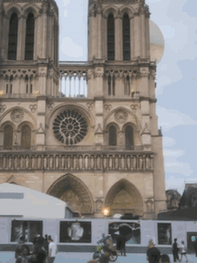 Large Building With Clock And Many Windows GIF