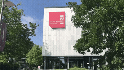 Large Building With Red Staffordshire University Sign GIF