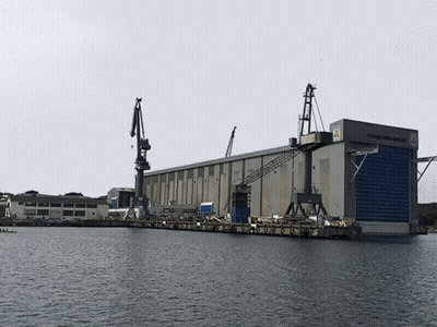 Large Building With Sign Kleiner Schiffswerft GIF