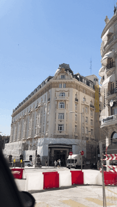 Large Building With Sign Saying Avenida GIF