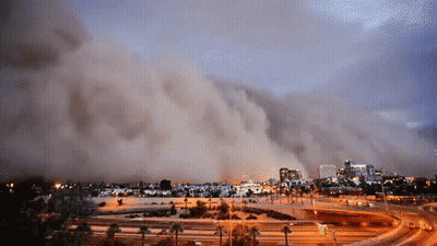 Large Cloud Of Smoke Over City GIF