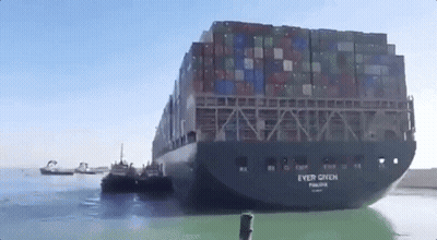 Large Container Ship Towed By Tug Boat GIF