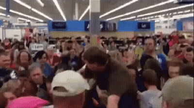 Large Crowd In Store With 5 Sign GIF