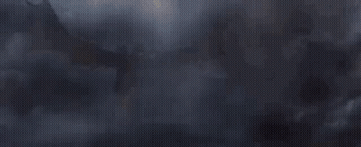 Large Dragon Flying Through Foggy Sky GIF