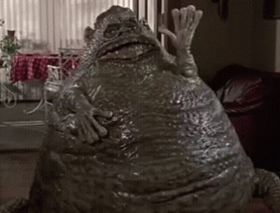 Large Frog Sitting In Living Room GIF