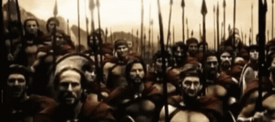 Large Group Of Soldiers With Spears And Shields Standing In A Line GIF