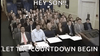 Large Group Sitting In Room Saying Hey Son Let The Countdown Begin GIF