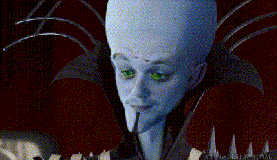 Large Headed Green Eyed Cartoon Character Staring Camera GIF