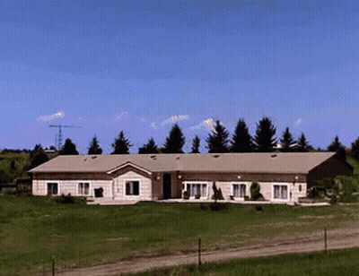 Large House In Grassy Field GIF