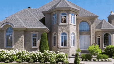 Large House With Gray Roof And Man Woman In Window GIF