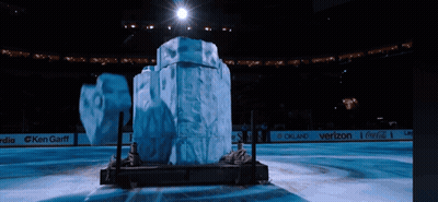 Large Ice Sculpture In Stadium With Coca-Cola And Verizon Ads GIF