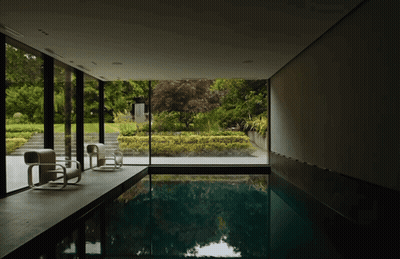 Large Indoor Swimming Pool Surrounded By Window GIF