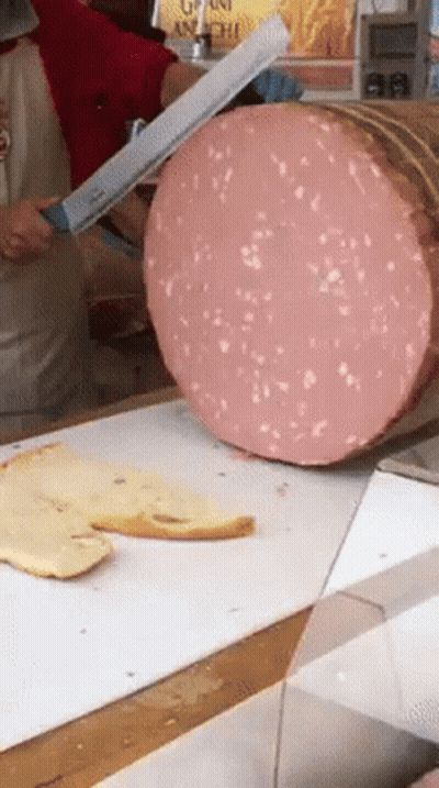 Large Piece Of Meat Being Sliced By Knife GIF