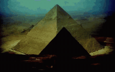 Large Pyramid In Desert With Blue Sky GIF