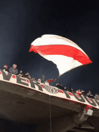 Large Red White And Blue Flag Flying Over River Banner GIF
