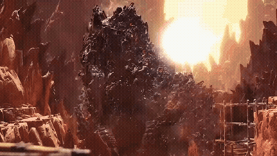 Large Rock In Desert With Sun Behind GIF