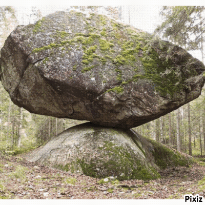 Large Rock On Smaller Rock In Woods GIF