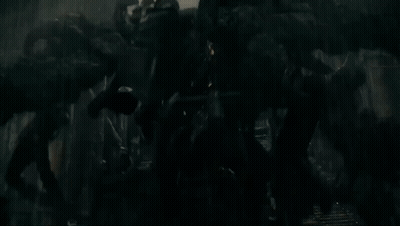 Large Rock With Glowing Eyes In Dark Cave GIF