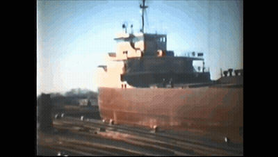 Large Ship Docked With People GIF