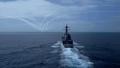 Large Ship Floating In Ocean With Smoke Trails GIF