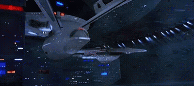 Large Space Ship Flying Through Space GIF