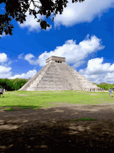 Large Stone Pyramid Blue Sky White Clouds GIF