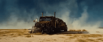Large Truck Parked In Dirt Field GIF