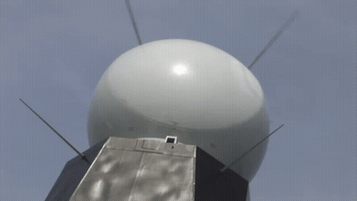 Large White Ball With Antennas Against Blue Sky GIF