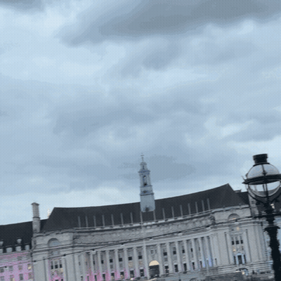 Large White Building With Clock Tower GIF
