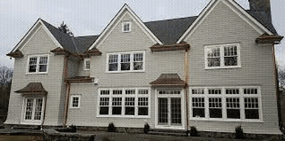 Large White House With Many Windows And Chimney GIF