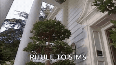 Large White House With Tree Saying Rhule To Sims GIF