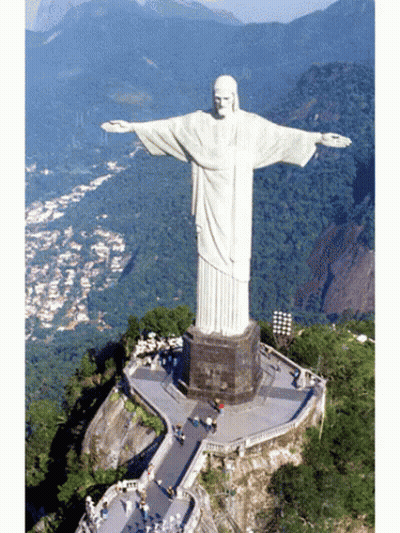 Large White Jesus Statue On Hill GIF
