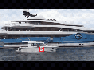 Large Yacht With Boat Saying 90.7 Ben GIF