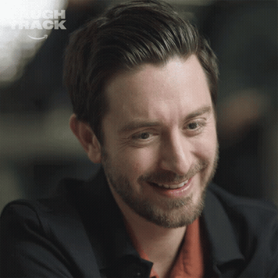 Laugh Track Logo Behind Man's Face GIF