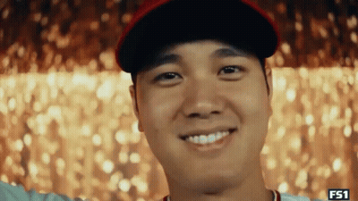Laughing Man Covering Ears In Mirror GIF
