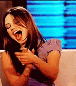 Laughing Mila Kunis GIF