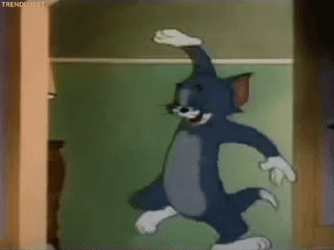 Laughing Tom Cat Hitting His Knee GIF