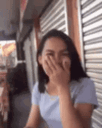 Laughing Women Covering Mouth With Missing Teeth  GIF