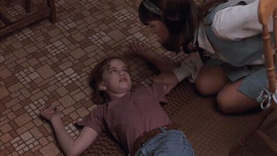 Laying Girl Eyes Closed Watched By Another GIF